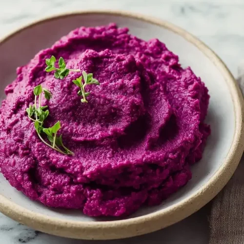 Roasted purple sweet potato recipe with honey and sesame seeds.