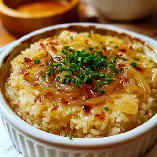 Baked onion soup rice topped with melted cheese