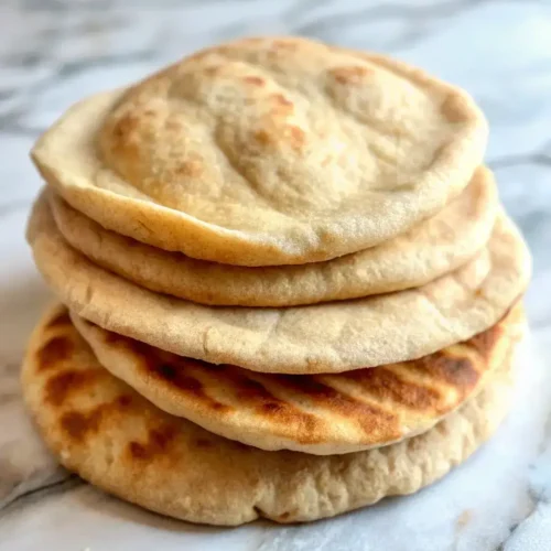 Soft and fluffy keto pita bread ready to be filled with your favorite low-carb toppings
